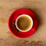 imgi_56_top-view-cup-milk-coffee-with-roasted-beans_23-2148251667