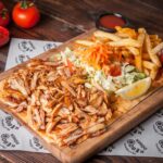 imgi_57_from-fried-chicken-pieces-with-lemon-french-fries-salad-wood-plate_176474-2629